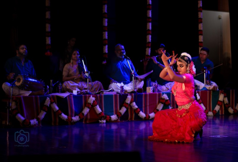Dancer on stage in front of live musicians