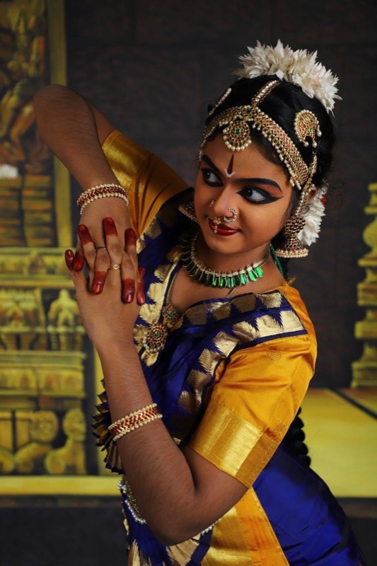 Close portrait with a temple backdrop
